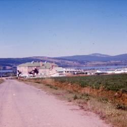 Photographs of archery, camping, and buildings at the Lejac Indian Residential School