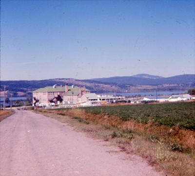 Photographs of archery, camping, and buildings at the Lejac Indian Residential School