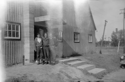 Photographs of boys in front of the arena