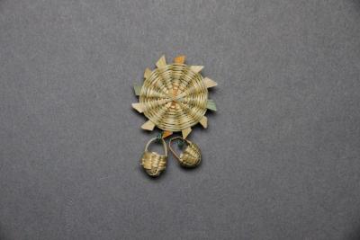 Woven pinwheel brooch