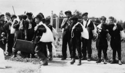Photograph of boys getting ready for home