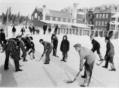 Photograph of students playing schoolyard hockey
