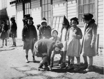 Photograph of school girls playing hop scotch