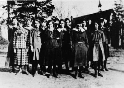 Photograph of a group of Shingwauk students in front of the chapel