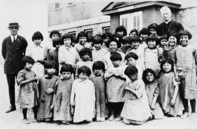 Photograph of students with the minister and a teacher