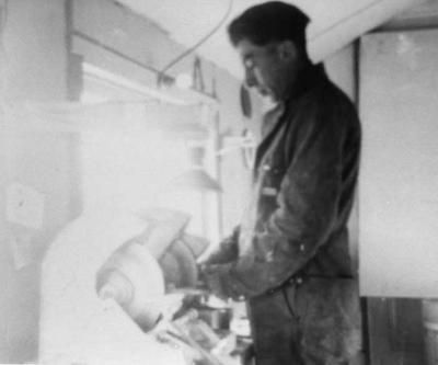 Photograph of a man working in the woodworking shop