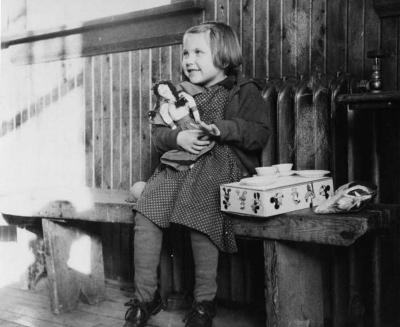 Photograph of Margaret Neegan with Christmas toys