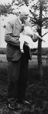 Photograph of Dr. T.B.R. Westgate and the youngest student at St. John's Residential School