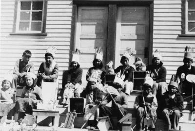 Photograph of day school students displaying their handicrafts