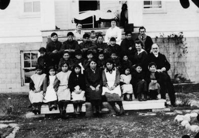 Photograph of students and staff on the front steps