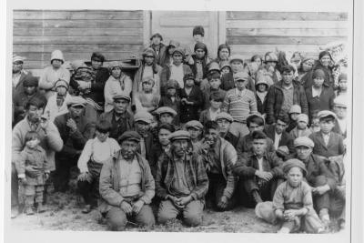 Photograph of a group of people outside at Fort Albany