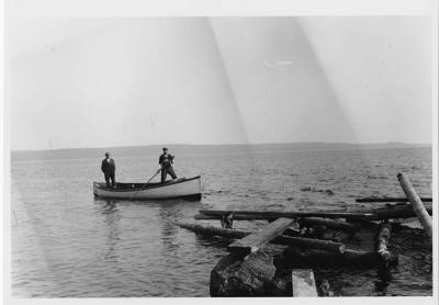 Photograph of two men in a boat at Cape Croker
