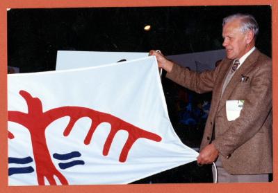 Photographs of the thunderbird flag and flag raising