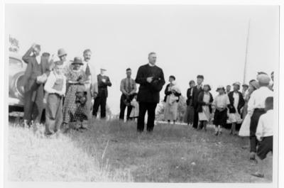 Photograph of a group of people with Bishop Dignan