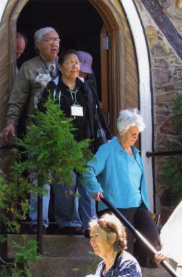 Photographs of attendees exiting the chapel service